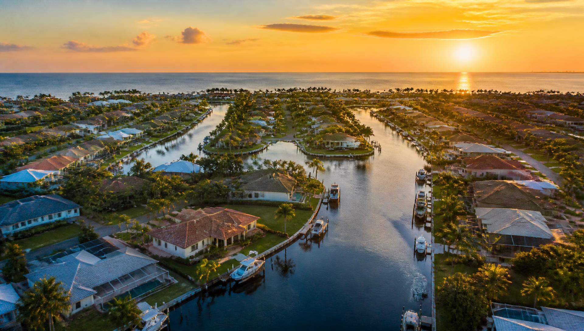 Aerial view of a waterfront Southwest Florida neighborhood at sunset